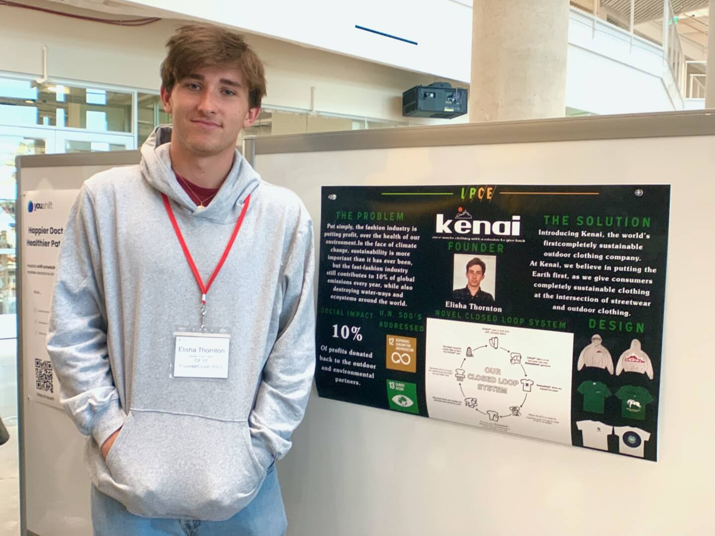 Elisha Thornton with a poster for the start-up "Kenai"