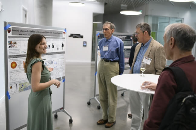 Nexus attendees chat with Ph.D. candidate Heidi Pickard about her research