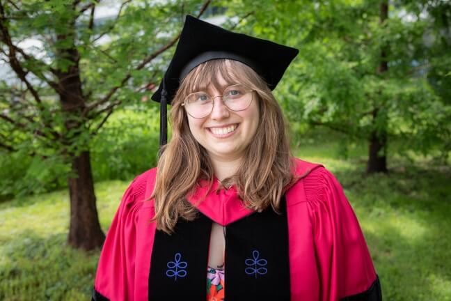 Harvard SEAS student Caroline Martin wearing her crimson regalia