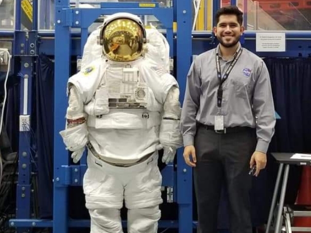 Juan Carlos Lopez with an EVA suit