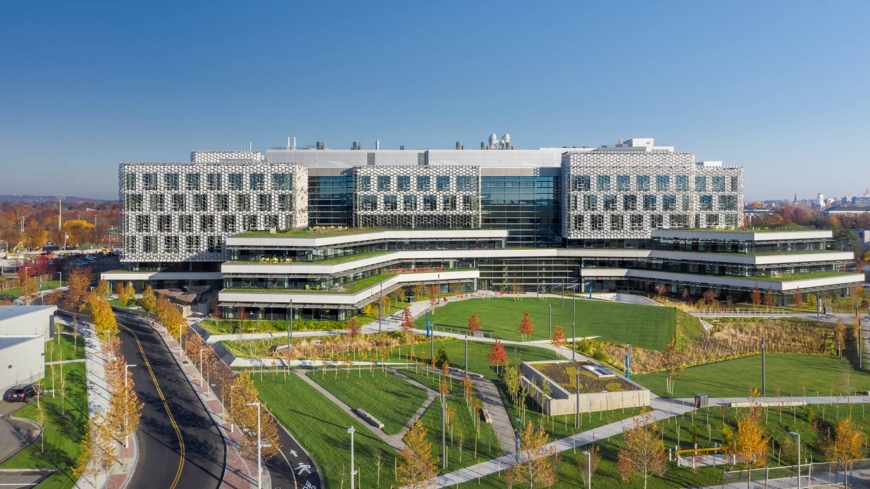 Landscape of the Science & Engineering Complex with the Engineering Yard and autumnal trees in the forefront. 