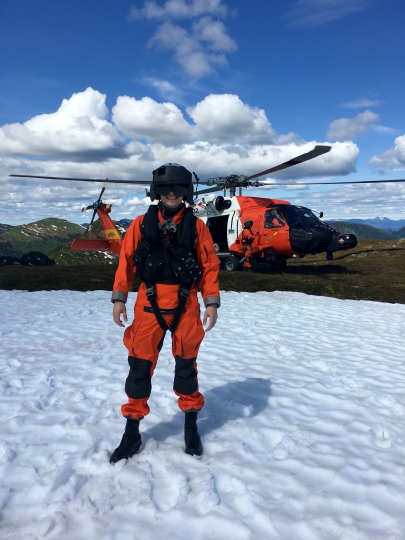 Andrew Lund in front of a helicopter