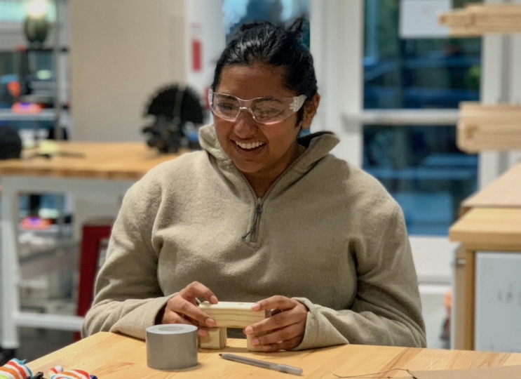 Binita Gupta assembles a wooden holder