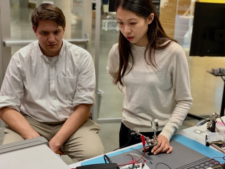 Cloud Barre and Kyra Mo test wiring at the Science and Engineering Complex