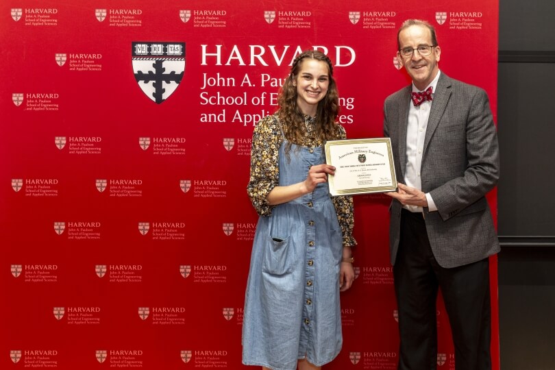 Ariann Jones receives her award from the Society of American Military Engineers for her senior capstone project.