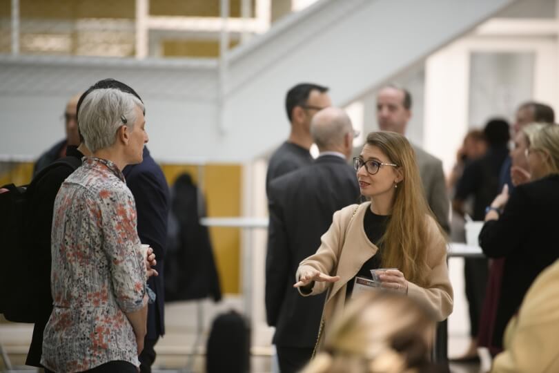 Harvard faculty and alumni mingle during the Nexus morning reception. 