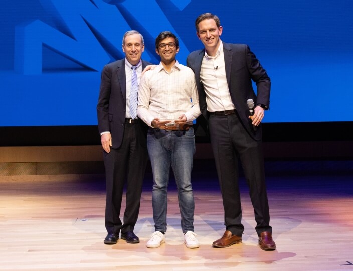 Penguin.ai founder Rohan Doshi, center, with Harvard President Lawrence Bacow and Harvard Innovation Labs Bruce and Bridgitt Evans Executive Director Matt Segneri at the President's Innovation Challenge Awards Ceremony