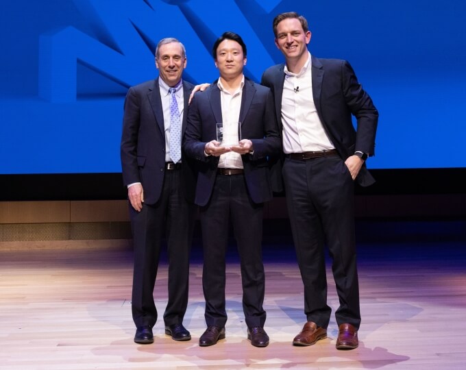 Stochastic co-founder Glenn Ko, center, with Harvard President Lawrence Bacow and Harvard Innovation Labs Bruce and Bridgitt Evans Executive Director Matt Segneri at the President's Innovation Challenge Awards Ceremony