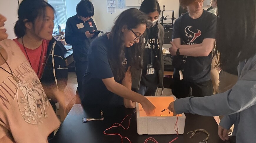 Students from Bellaire High School in Texas experiment with quantum superconductivity during the "Quantum Engineering Research and You" outreach program.