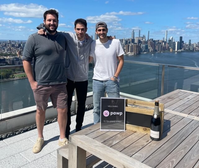 Pawp co-founders Cody Simons, Andrew Malek and Marc Atiyeh on a roof overlooking New York City and the Hudson River