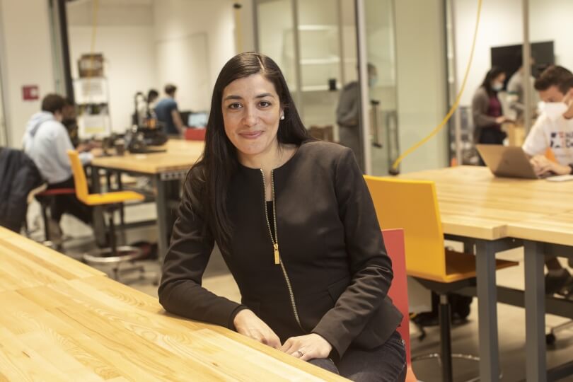 image of Stephanie Gil leaning against a table