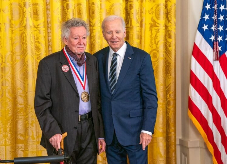 Sheldon Weinbaum, S.M. '60, Ph.D. '63 and U.S. President Joe Biden next to an American flag