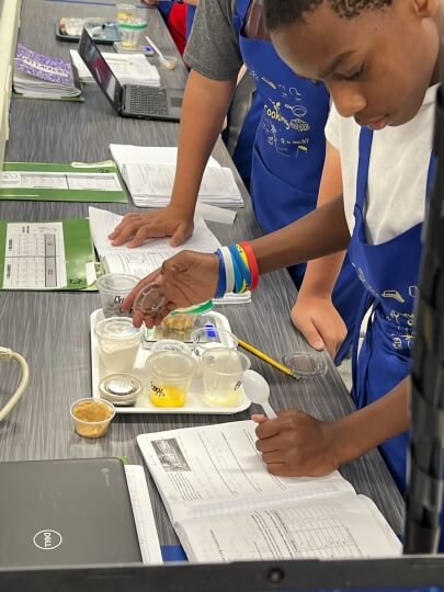 Students doing a science lesson about chocolate chip cookies