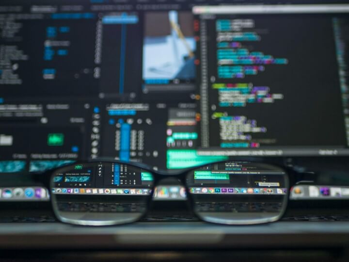 Glasses in front of computer screens