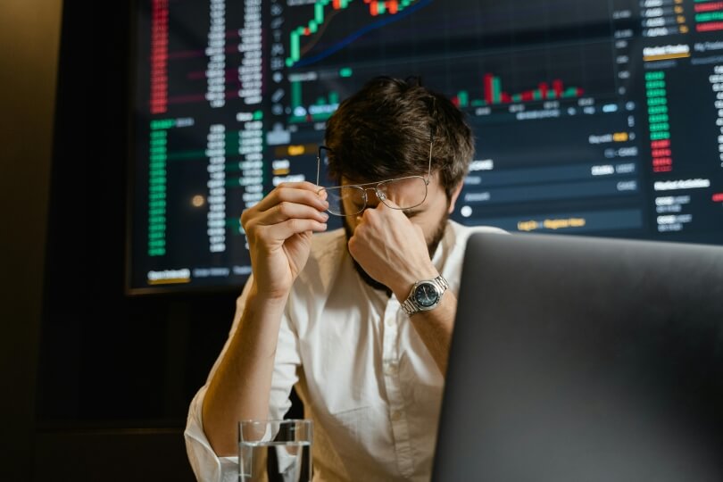 Frustrated man behind his laptop